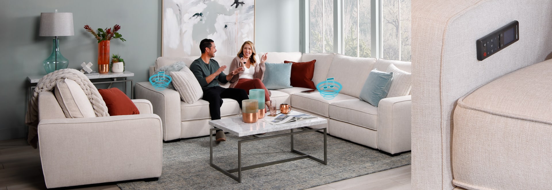 White Sectional with magnetic remote and soundwave icons