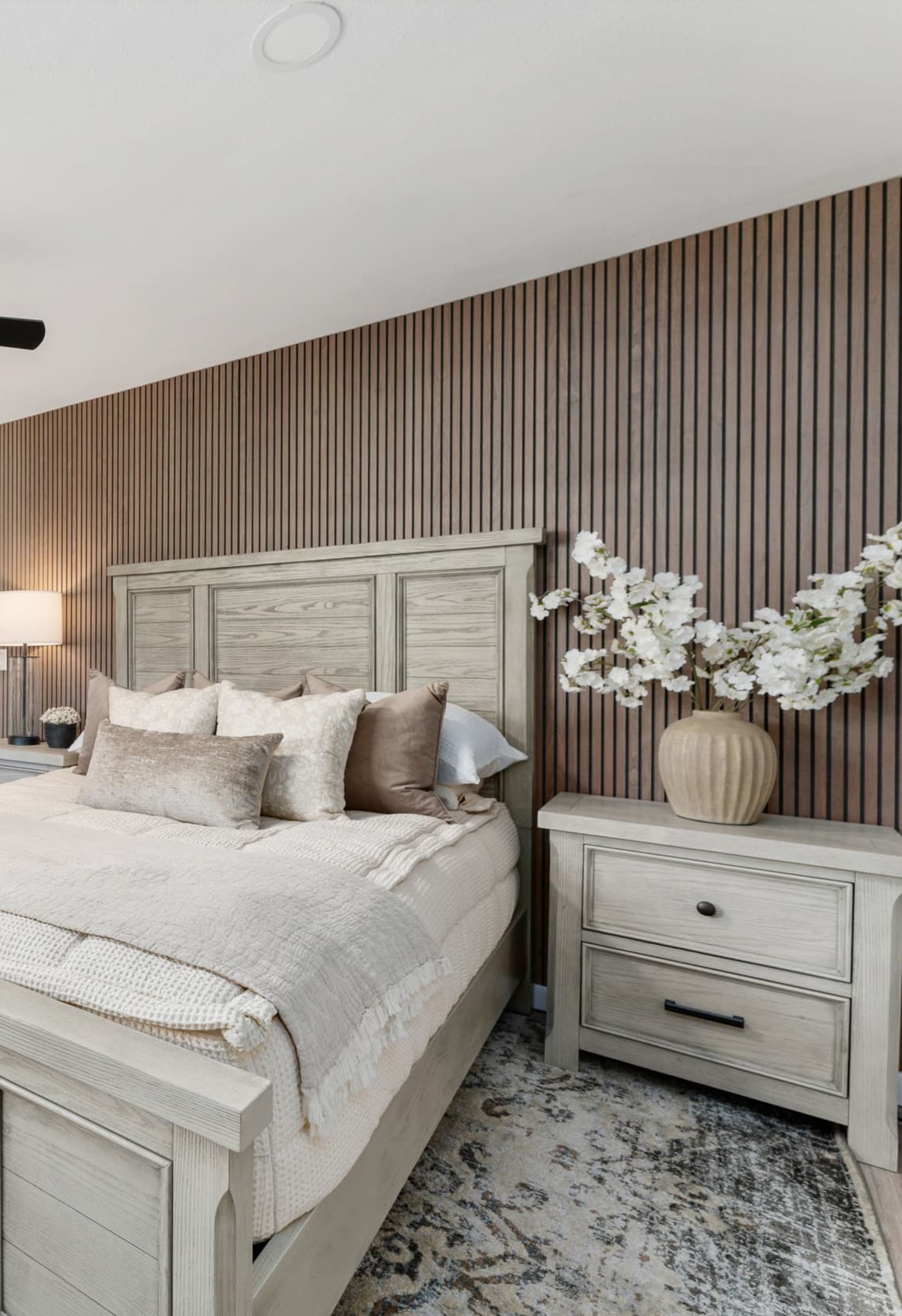 Rustic gray panel bed with two matching nightstands in Kelli Bateman's Airbnb fourth bedroom