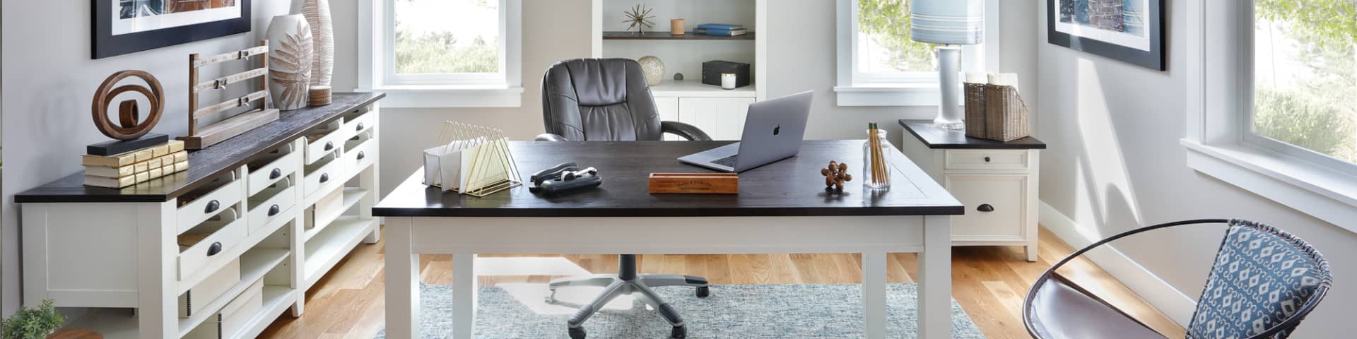 The farmhouse-style, two-tone Mountain Home Desk and matching storage in office window scene
